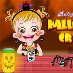 Dziewczynka z uśmiechem ozdabia stół na Halloween, na którym znajdują się słoik z dynią i papierowy pająk