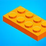 Pomarańczowy klocek lego na niebieskim tle