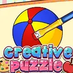 Piłka plażowa w kolorach czerwonym, niebieskim i żółtym malowana pędzlem z podpisem creative puzzle na tle notesu z rysunkami artystycznymi