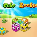 Kolorowe klocki z wizerunkami zwierząt na tle słonecznego krajobrazu z logo Cube Zoobies