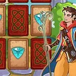 Mężczyzna z magiczną laską stoi przed planszą z kartami ozdobionymi klejnotami na tle zielonego krajobrazu