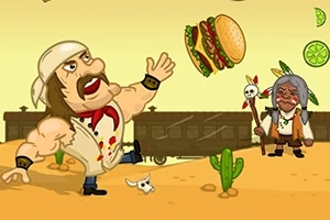 Mężczyzna w białej bandanie i muskułach kopie hamburgera na pustynnym tle z kaktusami, psem i pociągiem, obok stoi starszy mężczyzna z laską ozdobioną czaszkami