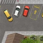 Widok z lotu ptaka na parking z czterema samochodami w kolorach żółtym, białym, czerwonym i żółtym, oznaczenia dla strefy parkowania i trawnika z drzewami