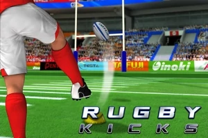 Zawodnik w czerwonych skarpetach kopiący piłkę do rugby na zielonym boisku z bramką w tle