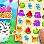 Kolorowa plansza z owocami i słodyczami, postać o wyglądzie jajka z kropkami oraz napis Sugar Heroes