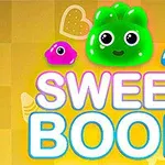 Kolorowe, uśmiechnięte żelki w odcieniach zielonym, różowym i niebieskim na żółtym tle z napisem SWEET BOOM