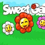 Kolorowe kwiaty z uśmiechniętymi buźkami na tle zielonej trawy i błękitnego nieba z napisem Sweet Garden ozdobionym biedronką