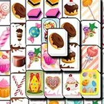 Kolorowe kafelki z grafikami słodyczy, takich jak ciastka, lizaki, i muffiny, ułożone w warstwowy wzór